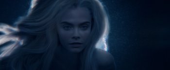 Movie still from “Pan” (2015), directed by Joe Wright – A woman with long blonde hair is in the dark; Close Up shot, Overhead angle