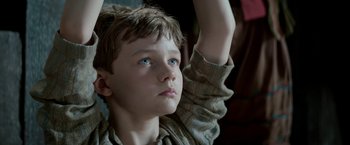 Movie still from “Pan” (2015), directed by Joe Wright – A young boy looking up into the sky; Close Up shot, Low angle