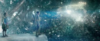 Movie still from “Pan” (2015), directed by Joe Wright – A man standing in the snow looking up at the sky; Extreme Wide shot, Low angle