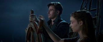 Movie still from “Pan” (2015), directed by Joe Wright – A man and a woman sitting at a table; Close Up shot, Over the shoulder angle