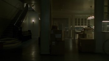 Movie still from “Panic Room” (2002), directed by David Fincher – A room filled with furniture and boxes on the floor; Extreme Wide shot, High angle