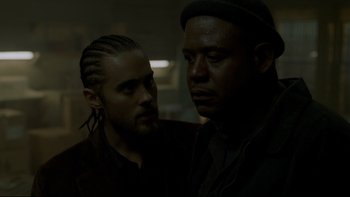 Movie still from “Panic Room” (2002), directed by David Fincher – Two men standing next to each other in a dark room; Close Up shot, Over the shoulder angle