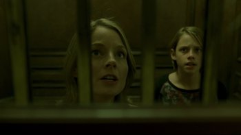 Movie still from “Panic Room” (2002), directed by David Fincher – Two people looking out a window in a train; Close Up shot, Low angle