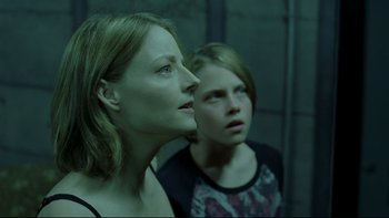 Movie still from “Panic Room” (2002), directed by David Fincher – A woman and a young girl looking at the camera; Close Up shot, Low angle