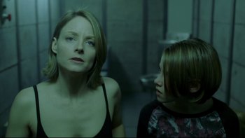 Movie still from “Panic Room” (2002), directed by David Fincher – A woman and a girl are looking at each other; Close Up shot, Over the shoulder angle
