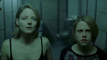 Movie still from “Panic Room” (2002), directed by David Fincher – Two women standing next to each other in a room; Medium shot, Low angle