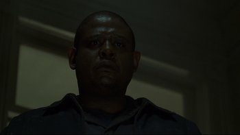 Movie still from “Panic Room” (2002), directed by David Fincher – A person looking at the camera; Close Up shot, Low angle