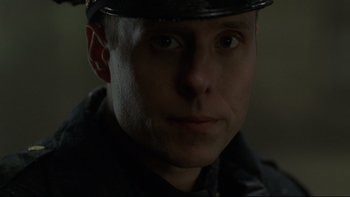 Movie still from “Panic Room” (2002), directed by David Fincher – A person wearing a hat; Close Up shot, Low angle