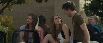 Movie still from “Paper Towns” (2015), directed by Jake Schreier – A group of young people sitting next to each other; Medium shot, Over the shoulder angle