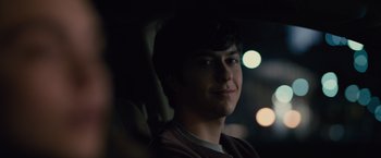 Movie still from “Paper Towns” (2015), directed by Jake Schreier – A young man sitting in a car at night; Close Up shot, Over the shoulder angle