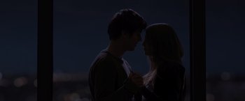 Movie still from “Paper Towns” (2015), directed by Jake Schreier – A man and a woman standing next to each other in the dark; Medium shot, Low angle
