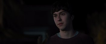 Movie still from “Paper Towns” (2015), directed by Jake Schreier – A young man is looking into the distance; Close Up shot, Over the shoulder angle