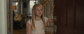 Movie still from “Paper Towns” (2015), directed by Jake Schreier – A young girl standing in front of a door; Medium shot, Over the shoulder angle