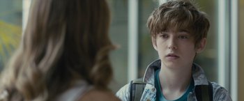 Movie still from “Paper Towns” (2015), directed by Jake Schreier – A young man and a young woman are talking to each other; Close Up shot, Over the shoulder angle