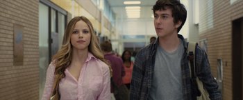 Movie still from “Paper Towns” (2015), directed by Jake Schreier – A man and a woman walking down a hallway; Medium shot, Over the shoulder angle