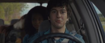 Movie still from “Paper Towns” (2015), directed by Jake Schreier – A man and a woman in the back seat of a car; Close Up shot, Over the shoulder angle