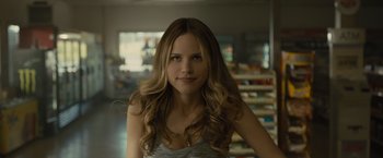 Movie still from “Paper Towns” (2015), directed by Jake Schreier – A beautiful young woman with long , blonde hair; Close Up shot, Over the shoulder angle