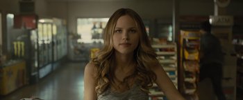 Movie still from “Paper Towns” (2015), directed by Jake Schreier – A beautiful young woman with long , blonde hair; Close Up shot, Over the shoulder angle