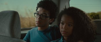 Movie still from “Paper Towns” (2015), directed by Jake Schreier – A man and a woman sitting next to each other on a bus; Close Up shot, Over the shoulder angle