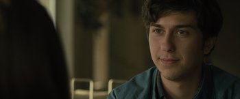 Movie still from “Paper Towns” (2015), directed by Jake Schreier – A young man sitting in front of a window; Close Up shot, Over the shoulder angle
