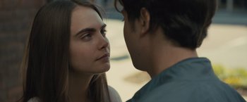 Movie still from “Paper Towns” (2015), directed by Jake Schreier – A man and a woman face to face in front of each other; Close Up shot, Over the shoulder angle