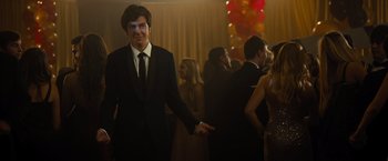 Movie still from “Paper Towns” (2015), directed by Jake Schreier – A man in a suit holding a hand in a woman's hand; Medium shot, Over the shoulder angle