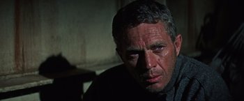 Movie still from “Papillon” (1973), directed by Franklin J. Schaffner – A person wearing a jacket; Close Up shot, Low angle