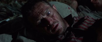Movie still from “Papillon” (1973), directed by Franklin J. Schaffner – A person laying on the ground; Close Up shot, High angle
