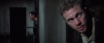 Movie still from “Papillon” (1973), directed by Franklin J. Schaffner – A person with a beard; Close Up shot, Low angle