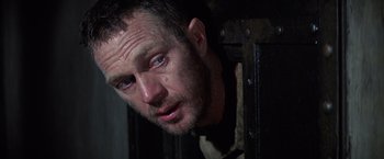 Movie still from “Papillon” (1973), directed by Franklin J. Schaffner – A person looking at the camera; Close Up shot, Low angle