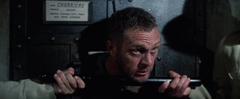 Movie still from “Papillon” (1973), directed by Franklin J. Schaffner – A person holding a knife; Close Up shot, High angle