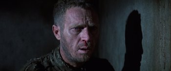 Movie still from “Papillon” (1973), directed by Franklin J. Schaffner – A person with a bloody nose; Close Up shot, Low angle