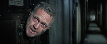 Movie still from “Papillon” (1973), directed by Franklin J. Schaffner – A person with blue eyes; Close Up shot, High angle