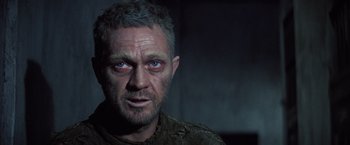 Movie still from “Papillon” (1973), directed by Franklin J. Schaffner – A person wearing a shirt; Close Up shot, Low angle