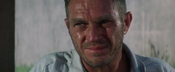 Movie still from “Papillon” (1973), directed by Franklin J. Schaffner – A man's face with a lot of dirt on his face; Close Up shot, Low angle