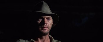 Movie still from “Papillon” (1973), directed by Franklin J. Schaffner – A person wearing a hat; Close Up shot, Low angle