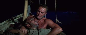 Movie still from “Papillon” (1973), directed by Franklin J. Schaffner – Two men are fighting on a boat in the dark; Close Up shot, Low angle