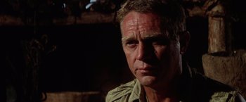 Movie still from “Papillon” (1973), directed by Franklin J. Schaffner – A man's face in the dark; Close Up shot, Low angle