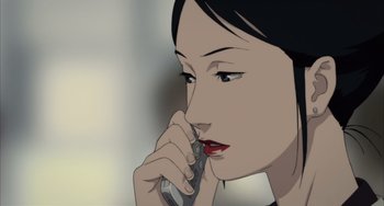 Movie still from “Paprika” (2006), directed by Satoshi Kon – A woman is talking on a cell phone; Close Up shot, High angle