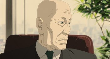 Movie still from “Paprika” (2006), directed by Satoshi Kon – An old man with a bald head wearing a suit and tie; Close Up shot, Low angle