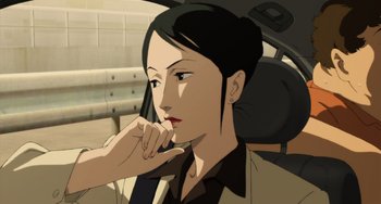 Movie still from “Paprika” (2006), directed by Satoshi Kon – A woman sitting in the back seat of a car; Close Up shot, High angle
