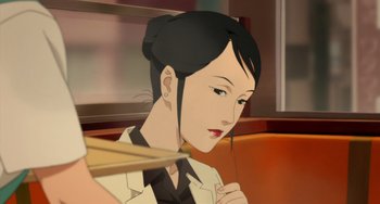 Movie still from “Paprika” (2006), directed by Satoshi Kon – An animated picture of a woman with chopsticks in her hand; Close Up shot, High angle