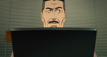 Movie still from “Paprika” (2006), directed by Satoshi Kon – A cartoon of a man looking at a computer screen; Close Up shot, Low angle