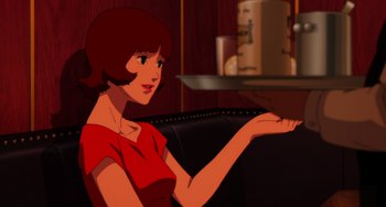 Movie still from “Paprika” (2006), directed by Satoshi Kon – A woman sitting in a chair holding out her hand; Medium shot, Over the shoulder angle