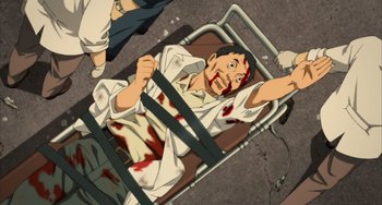 Movie still from “Paprika” (2006), directed by Satoshi Kon – An animated man is in a hospital bed with blood pouring out of his face; Medium shot, Overhead angle