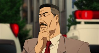 Movie still from “Paprika” (2006), directed by Satoshi Kon – An animated picture of a man in a suit and red tie looking pensive; Close Up shot, Over the shoulder angle