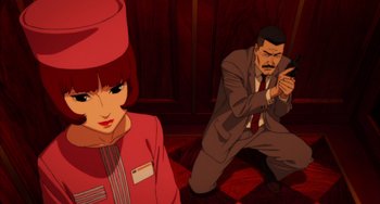 Movie still from “Paprika” (2006), directed by Satoshi Kon – A man kneeling down next to a woman in front of a door; Medium shot, High angle