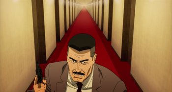 Movie still from “Paprika” (2006), directed by Satoshi Kon – An animated man in a suit and tie holding a gun in his hand; Medium shot, High angle
