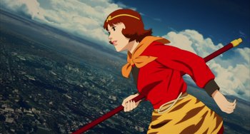 Movie still from “Paprika” (2006), directed by Satoshi Kon – An animated woman in a red shirt holding a red stick; Medium shot, Low angle