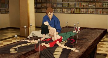 Movie still from “Paprika” (2006), directed by Satoshi Kon – An animated scene of a man helping a woman; Wide shot, High angle